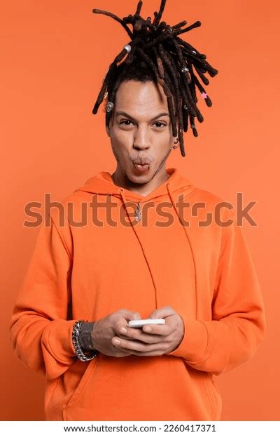 Tattooed Multiracial Man Dreadlocks Pouting Lips Stock Photo