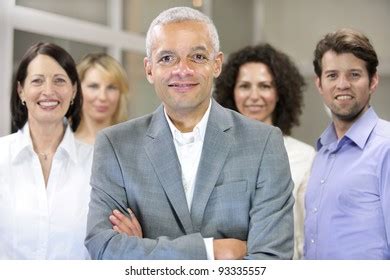 African American Volunteer Group Giving High Stock Photo