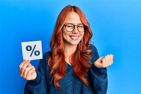 Young Beautiful Redhead Woman Holding Percentage Symbol Screaming Proud Celebrating Victory And