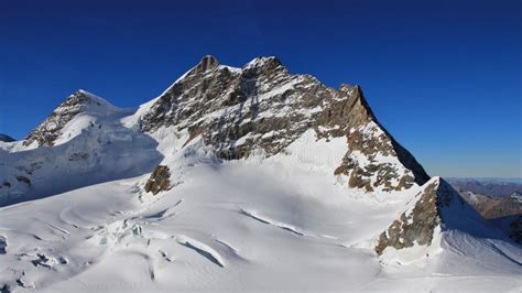 Peak of Mount Jungfrau and Glacier with Large Crevasses. Stock Photo - Image of nature ...