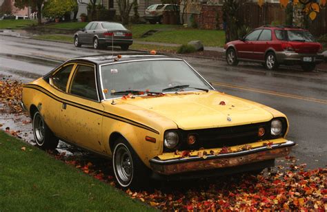 OLD PARKED CARS.: 1973 AMC Hornet X hatchback.