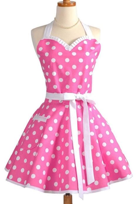 A Pink And White Polka Dot Apron Dress On A Mannequin Headdress