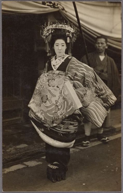 Oiran Parade Participant In Geta Sandals Accompanied By Servant Bearing