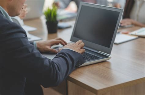 Premium Photo Businessman Using Laptop Computer While Meeting With