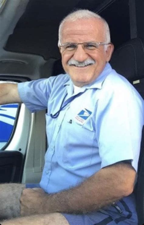 An Older Man Sitting In The Driver S Seat Of A Car