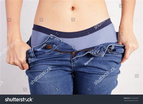 Sexy Woman Taking Off Jeans ภาพสต็อก 573165328 Shutterstock