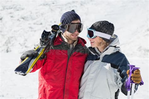 Happy Young Couple With Ski Boards On Snow Stock Photo Image Of