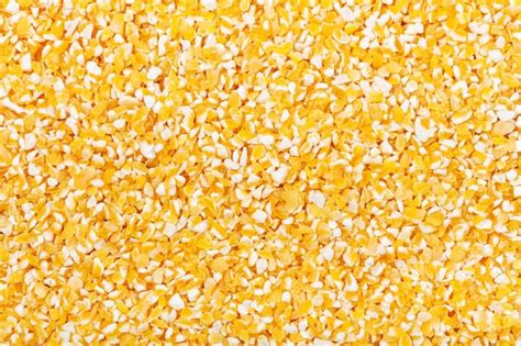 Premium Photo Raw Yellow Ground Corn Groats