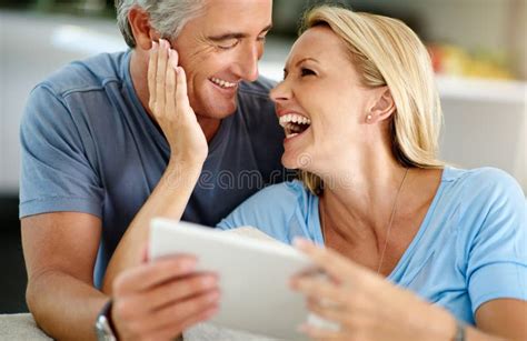 Who Doesnt Like A Good Meme An Affectionate Mature Couple Laughing