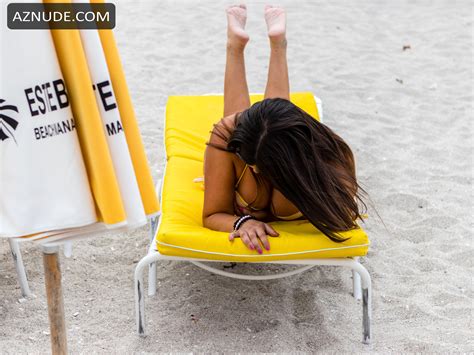 Claudia Romani Sexy On South Beach Wearing A Yellow And White Thong Bikini Aznude