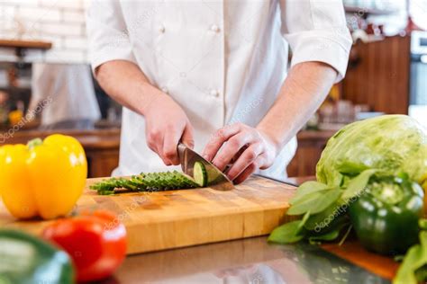 Hands Of Chef Cook Cutting Vegetables And Making Salad Stock Photo By