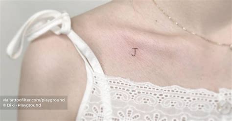 Minimalistic Style Letter J Tattoo Located On The