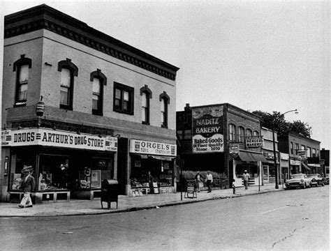 An Old Black And White Photo Of Some Buildings