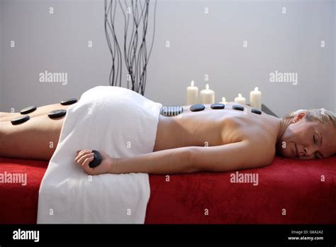 Woman Getting A Hot Stone Massage Stock Photo Alamy