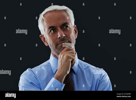 Coming Up With A Winning Strategy A Mature Man Looking At The Camera