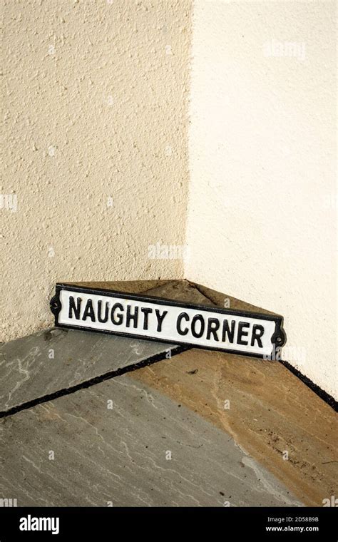 Cast Vintage Sign Saying Leaning Against A Corner Saying Naughty Corner