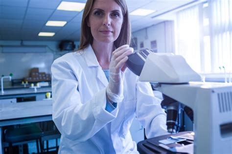 Premium Photo Scientist Working With A Microscope In Laboratory