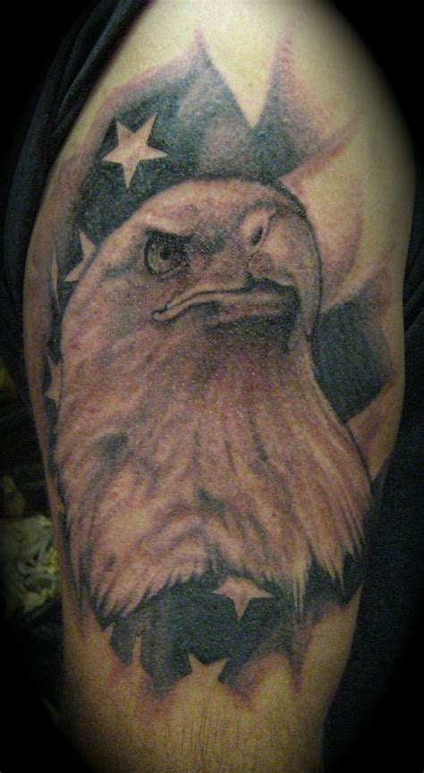 An Eagle And Stars Tattoo On The Arm