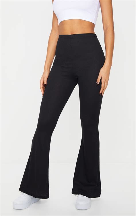 Black Ribbed Flared Trousers Trousers Prettylittlething