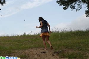 Piss Naughty Brunette Pisses Into A Sandpit In Forest XXX Dessert