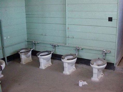 Soldiers sitting on military toilets chat - The Frontlines