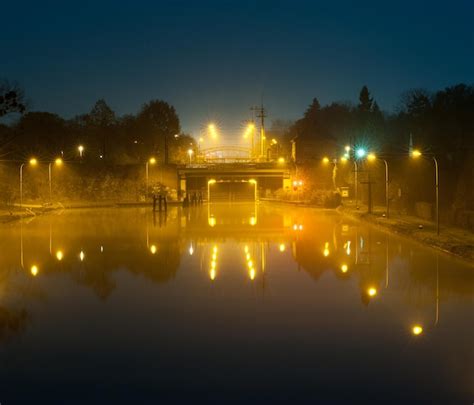 Premium Photo Illuminated Boats In Water At Night