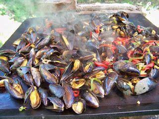 Mussels Being Cooked On An Outdoor Grill