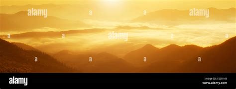 Mountain foggy sunrise Stock Photo - Alamy