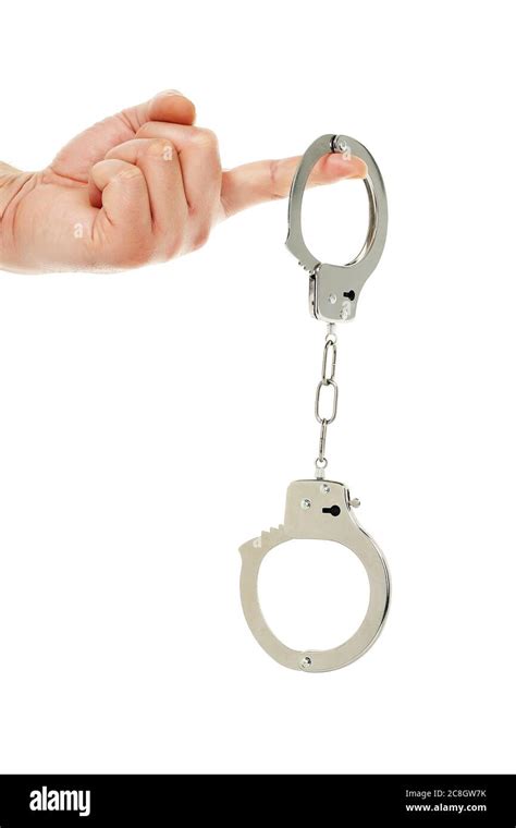 Hand Holding Handcuffs Isolated On White Stock Photo Alamy