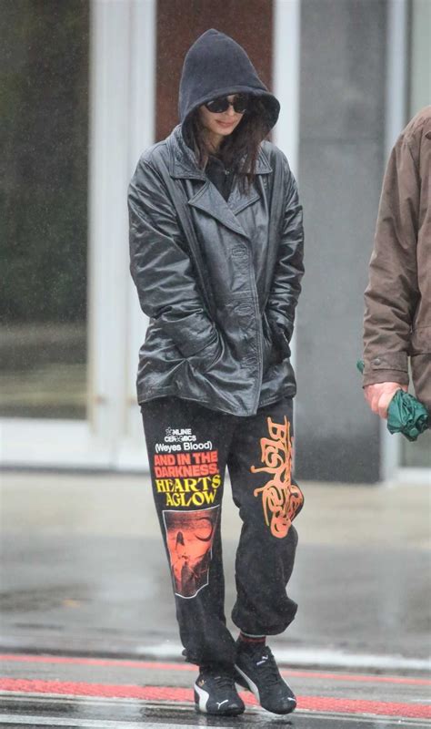 Emily Ratajkowski In A Black Leather Jacket Braves The Rain While Out