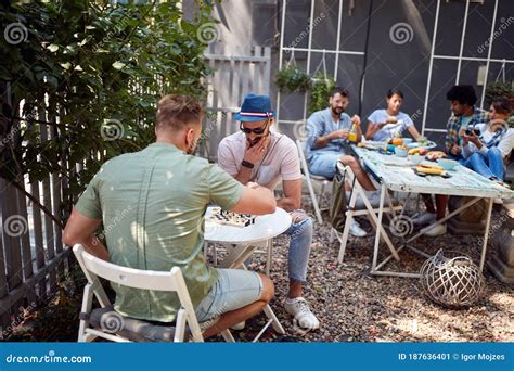 Group Of Young People Enjoy In Cafe`s Garden Stock Image Image Of