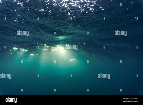 Rays Of Light Shining Through The Surface Of The Atlantic Ocean Into