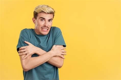 Premium Photo Gay Man Looking At Camera Gesturing He Is Cold