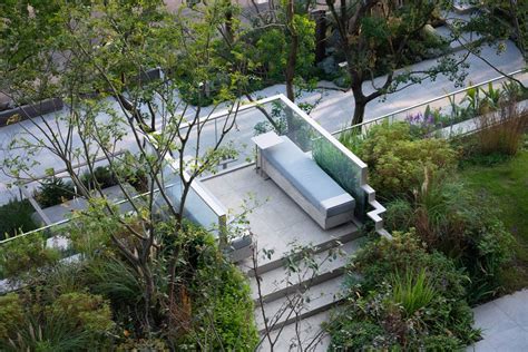 An Aerial View Of A Garden With Trees And Stairs Leading Up To The Top