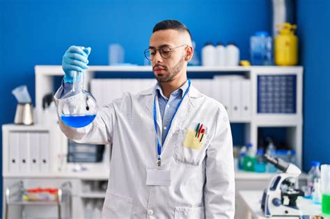 African American Man Scientist Holding Test Tube At Laboratory Stock