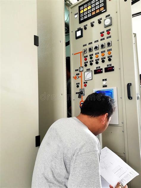 Electrical Engineer Rechecks Auto Voltage Regulator Setting Before