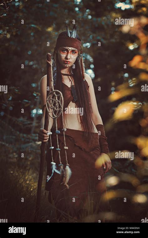 Beautiful female shaman. Colorful woods Stock Photo - Alamy