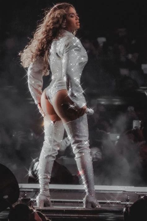 A Woman In White Outfit And Boots On Stage