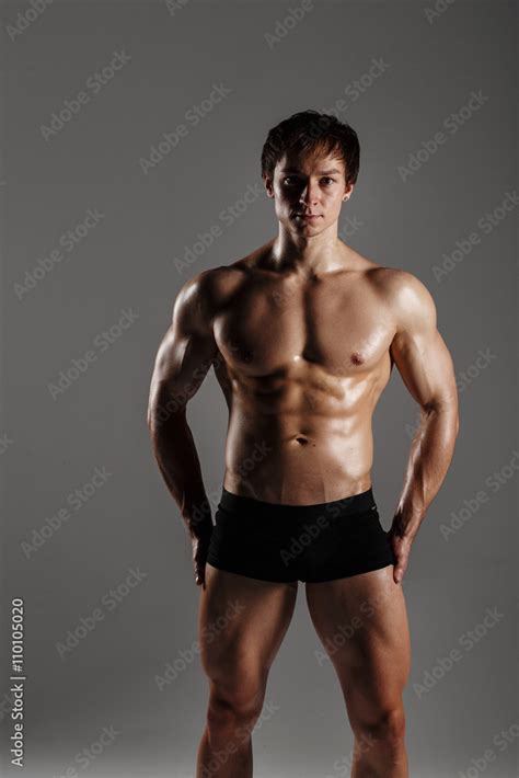 Strong Athletic Man Showing Muscular Body And Sixpack Abs Showing His