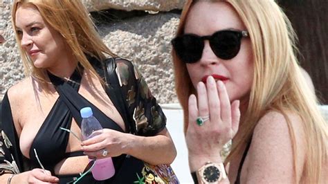 Lindsay Lohan S Boobs Spill Out Her Bikini As She Holidays In Italy