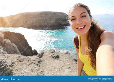 Tourist Woman Taking Selfie Picture At Playa Papagayo Landscape Happy