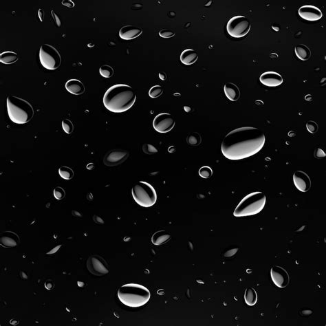 Gotas De Lluvia Sobre Un Fondo Negro Con Gotas De Lluvia Foto Premium