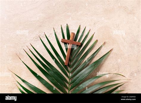 Palm Sunday Concept Wooden Cross Over Palm Leaves Reminder Of Jesus