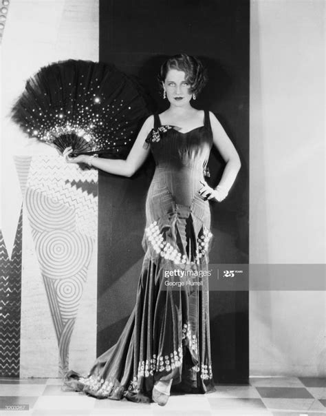 Hollywood Film Actress Norma Shearer Poses With A Fan In A Publicity Hollywood Fashion