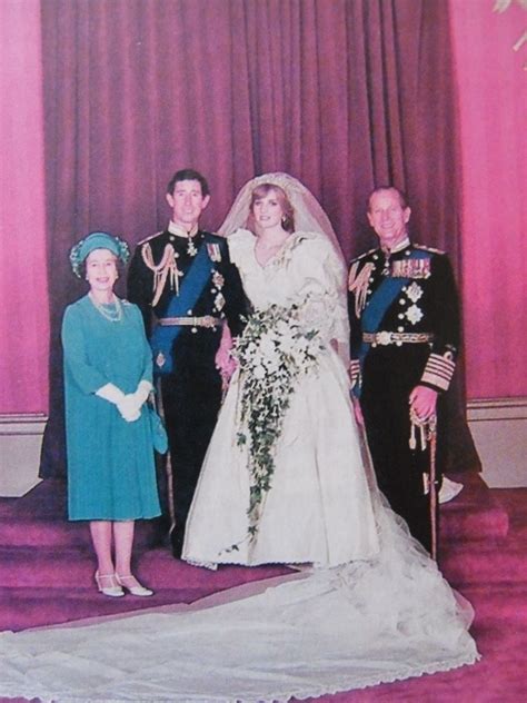 An Old Photo Of A Bride And Groom With Their Parents