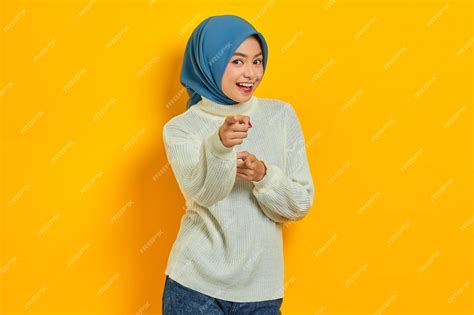 Premium Photo Overjoyed Beautiful Asian Woman In White Sweater Pointing Fingers At Camera