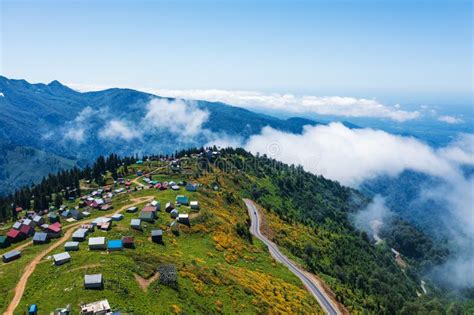 Elevated Aerial View Of Gomismta Village Perched Above Cloud Line