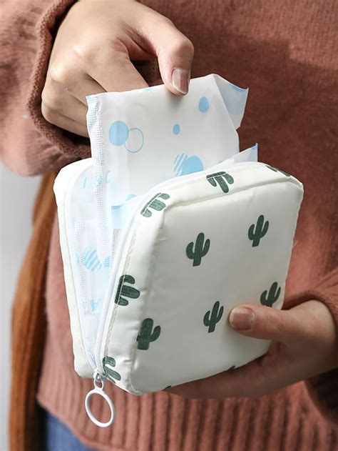 A Woman Is Holding Three Bags With Cactus Designs On Them And One Has A