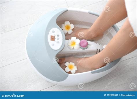 Woman With Beautiful Legs Using Foot Bath At Home Closeup Stock Image