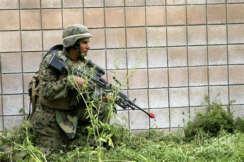 A Squad Automatic Weapon Gunner Posts Photograph By Stocktrek Images